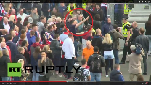 A loyalist protester nazi-salutes. Screencap taken from this video.